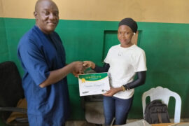 A web design student receiving certificate of training completion from the TheWebmakers Academy director. TheWebmakers Academy is web development training academy based in Ijebu Ode, Ogun State.