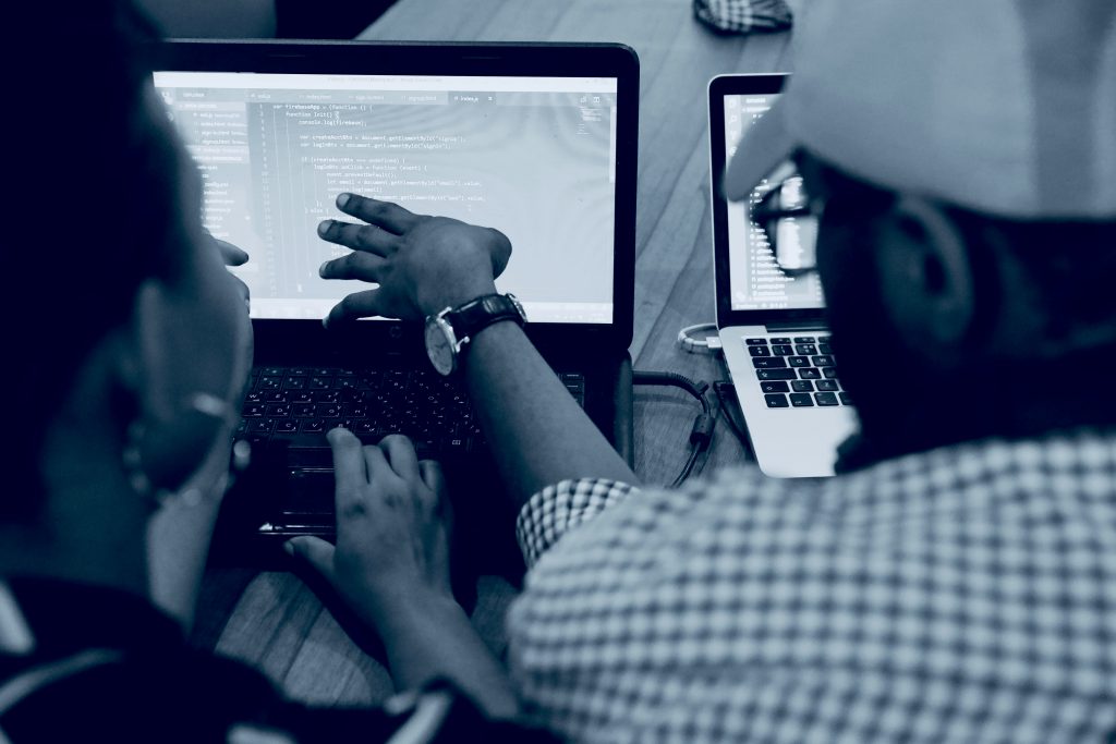 A web development tutor explains some points to a student at The Webmakers' web design training center Ijebu Ode, Ogun State.