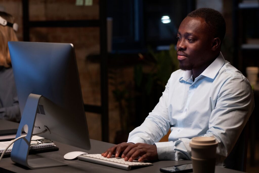 Image rep team member using desktop computer in an Office.